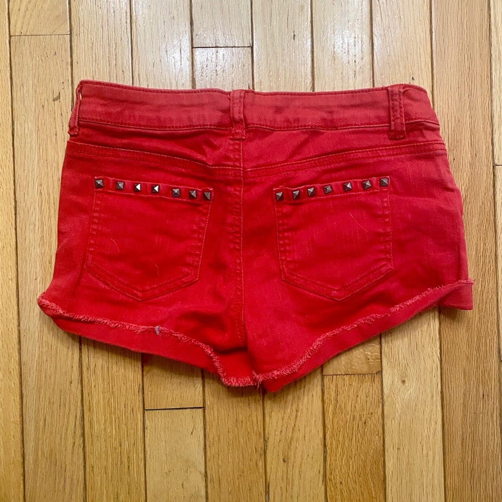 Studded red distressed shorts